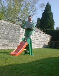 Ken standing on a slide